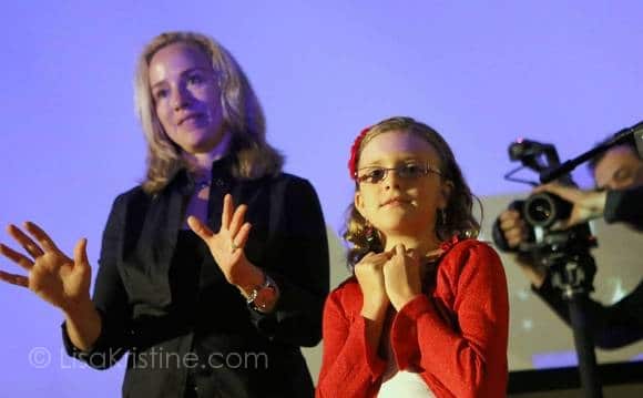 Documentary photographer Lisa Kristine, left, introduces Vivienne Harr, 9, during a lecture at the Orlando Museum of Art on Saturday, May 4, 2012. (Tom Burton, Orlando Sentinel / May 3, 2013)