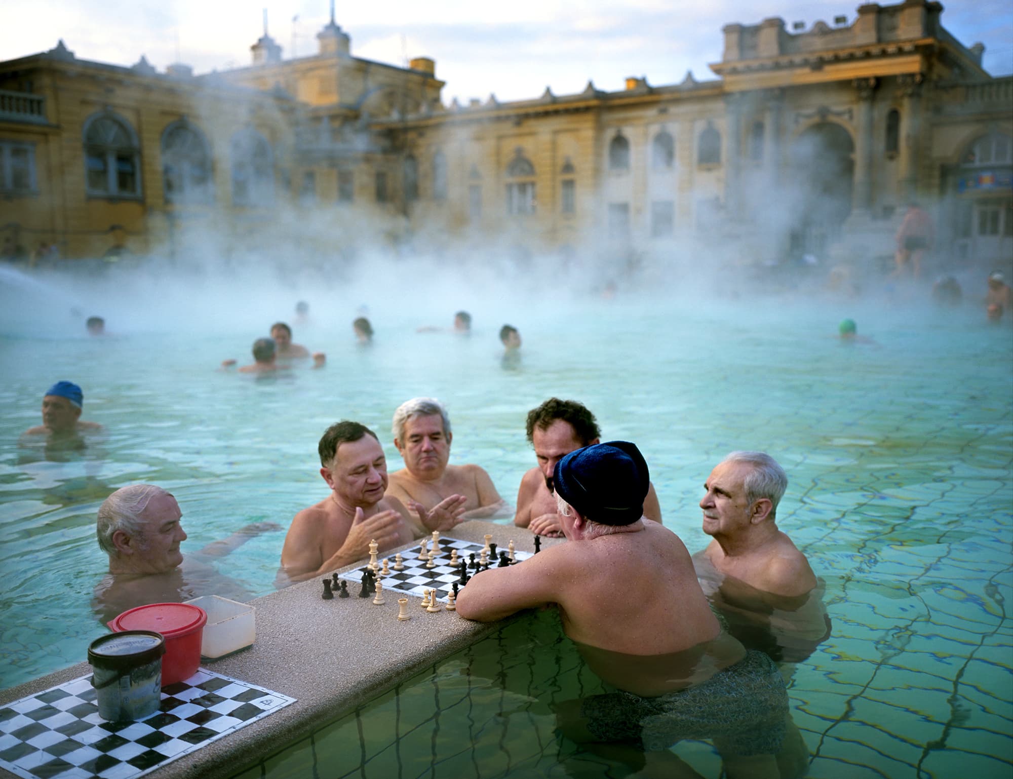 A striking photo of two individuals engrossed in a chess match in Budapest. Their intense focus highlights the universal appeal and strategic depth of the game.