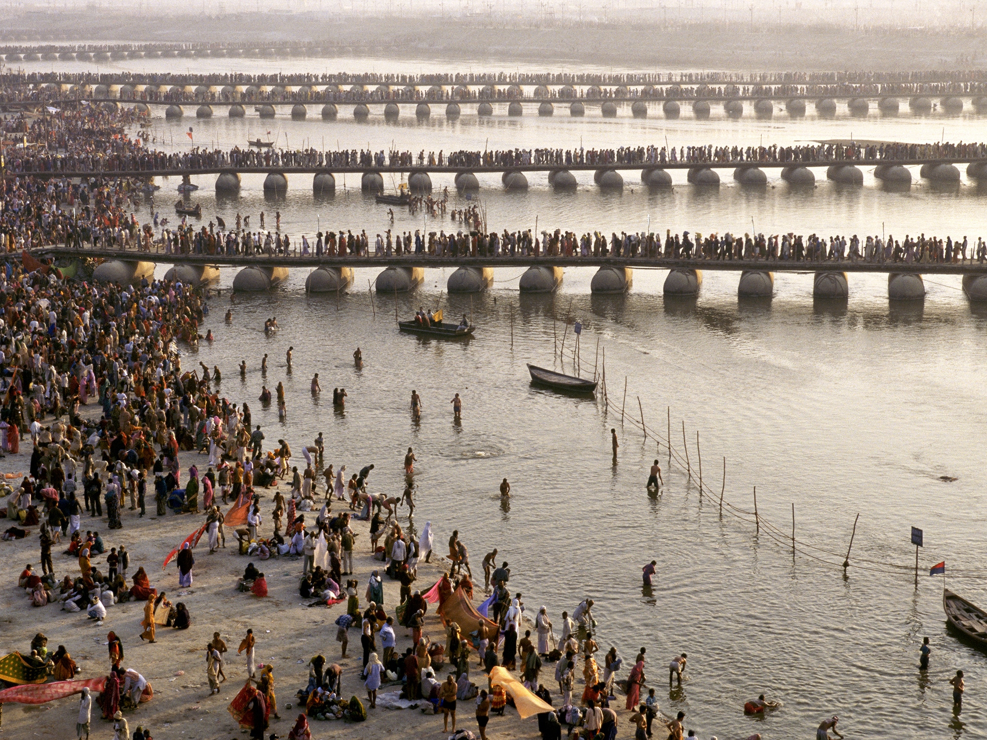 A vibrant depiction of India’s Kumbh Mela festival, showcasing pilgrims immersed in the sacred Ganges, symbolizing spiritual purification.